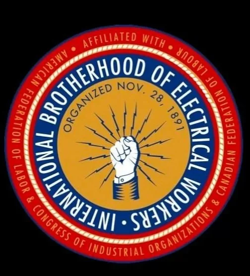 Seal of the International Brotherhood of Electrical Workers, with a clenched fist in the center and rays of light, indicating organization since 1891.