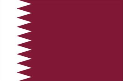 The flag of Qatar with a maroon background and a white vertical band with a serrated edge.