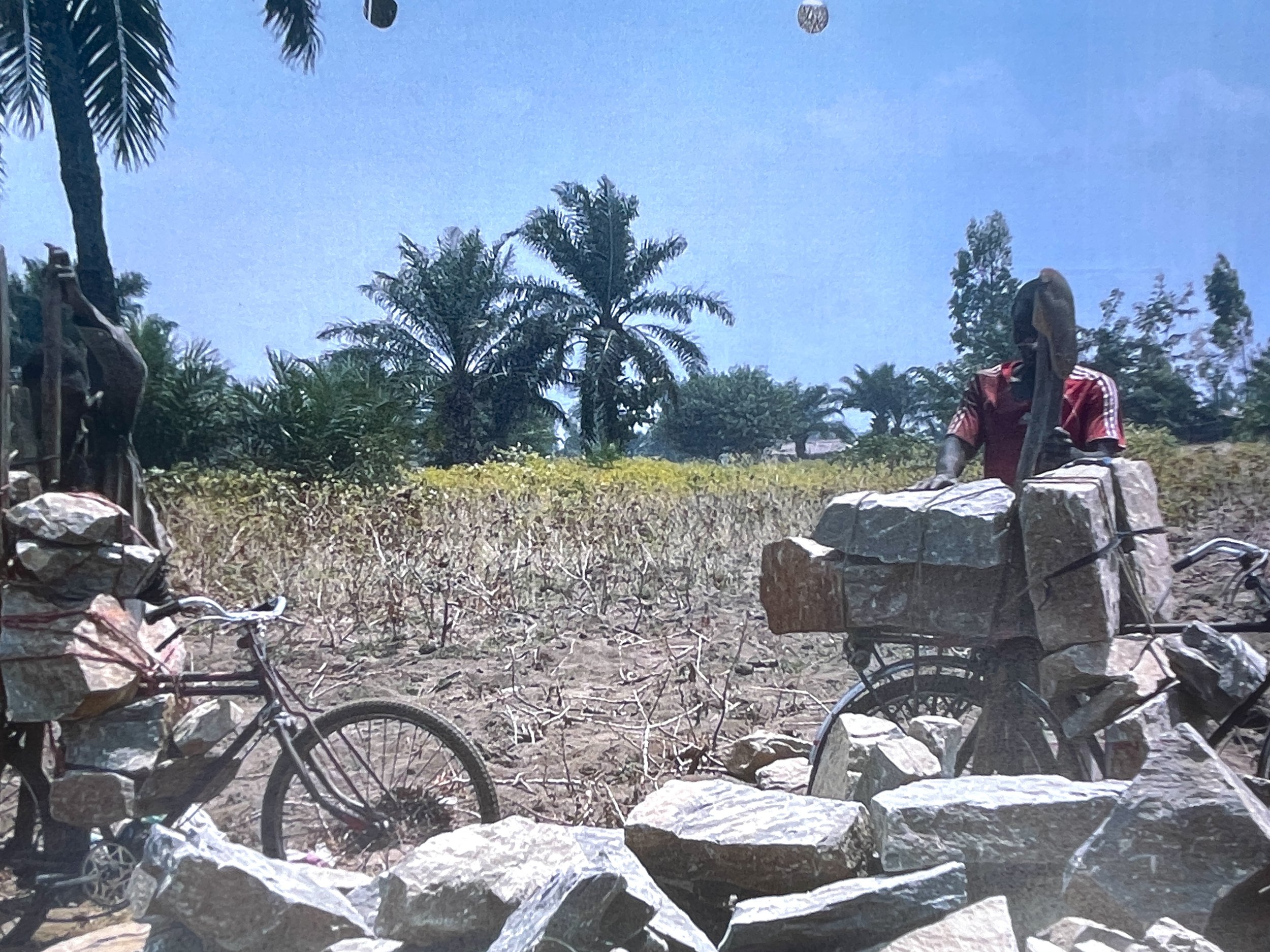 Step 2: Use bicycles to transport large foundation rocks to village via dirt roads