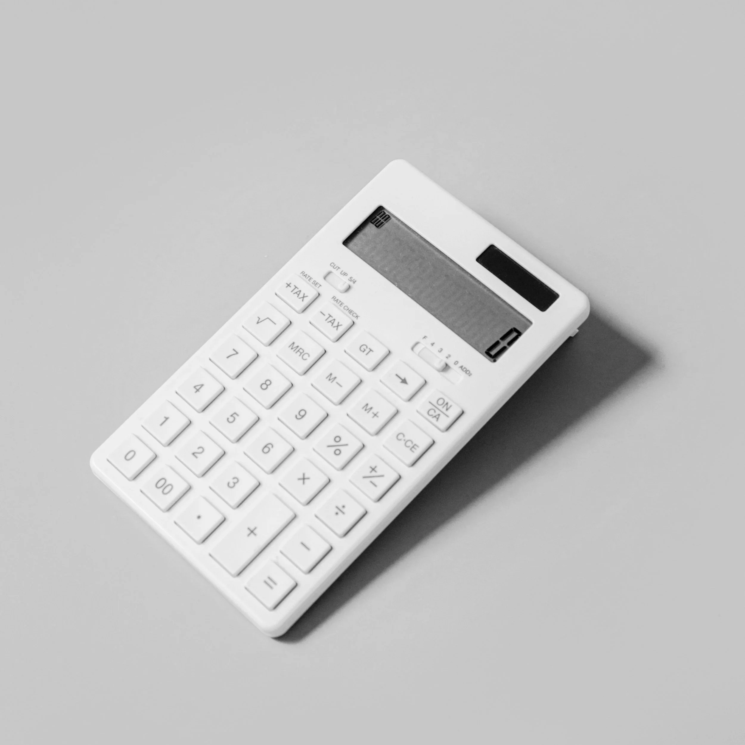 White calculator on a gray background