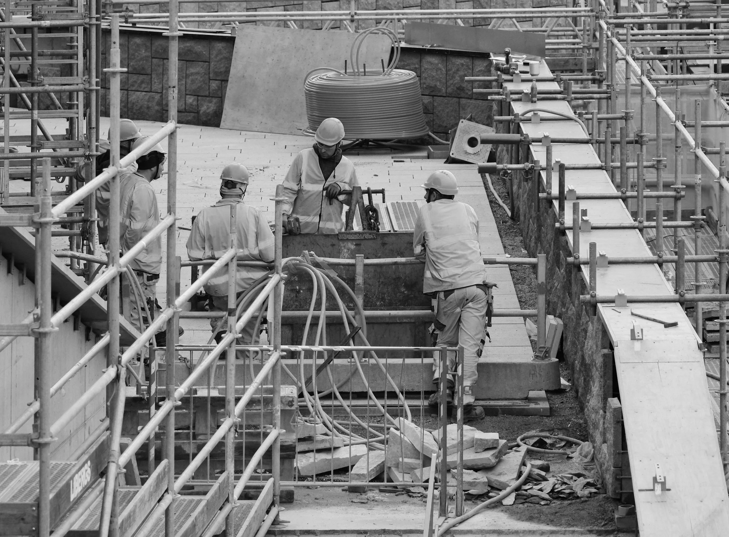 Construction workers on site with scaffolding