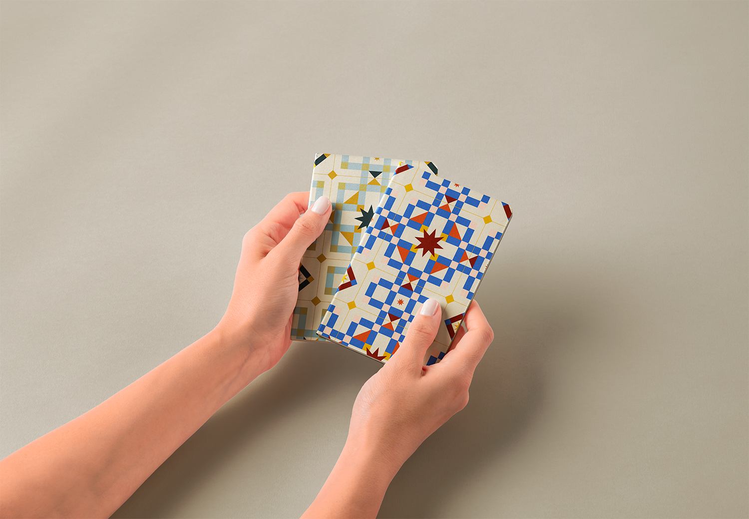 Hands-Holding-Pocket-Classic-Notebooks-Free-psd-Mockup.png