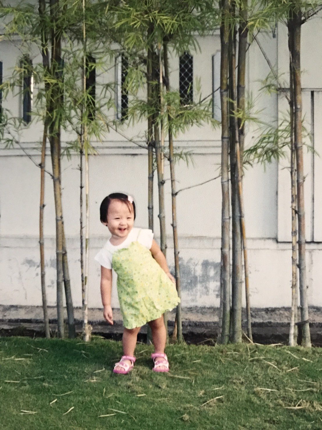 Vannysha as a toddler standing outside her childhood home.