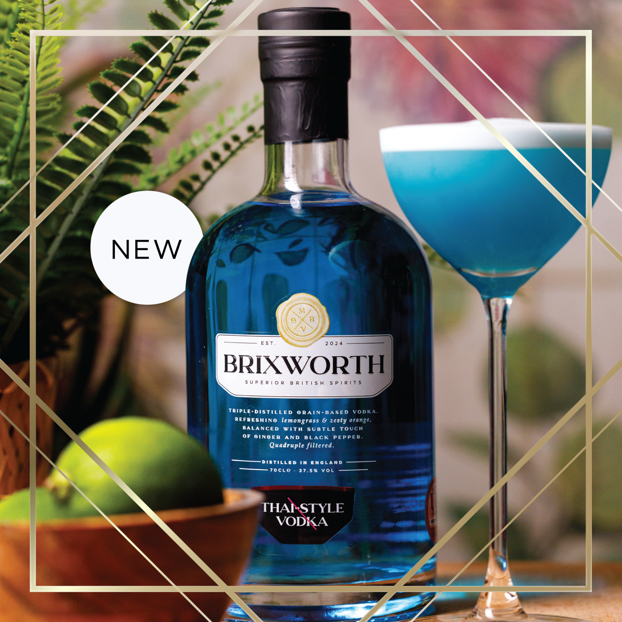 A blue bottle of Brixworth vodka with a label reading "Superior British Spirits" and "Thistyle Vodka" next to a glass of blue cocktail and a bowl of limes, surrounded by green foliage.