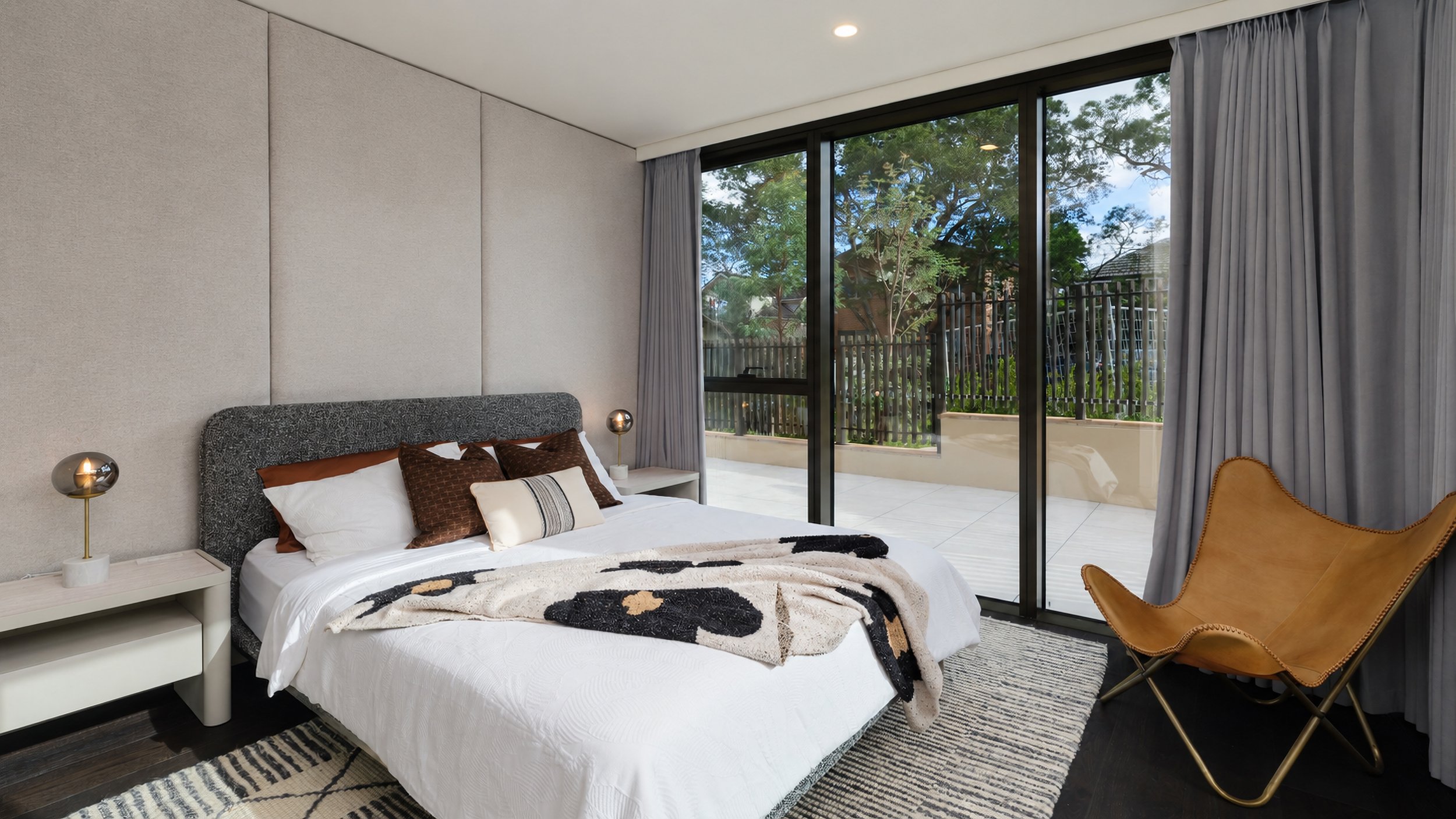 syp-homes-park-avenue-112-st-leonards-bedroom-boucle-headboard-butterfly-chair-01.jpg