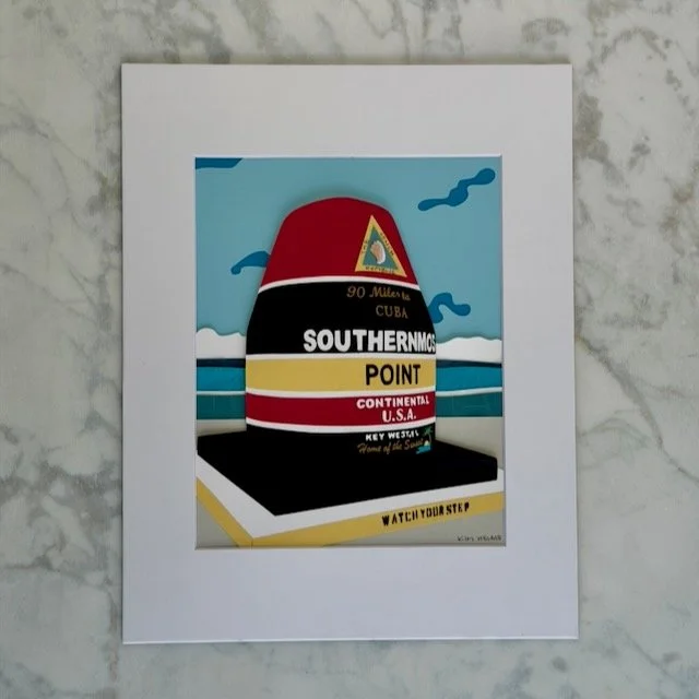 Southernmost Point original layered paper illustration in a white mat, the striped Key West buoy under a layered blue sky