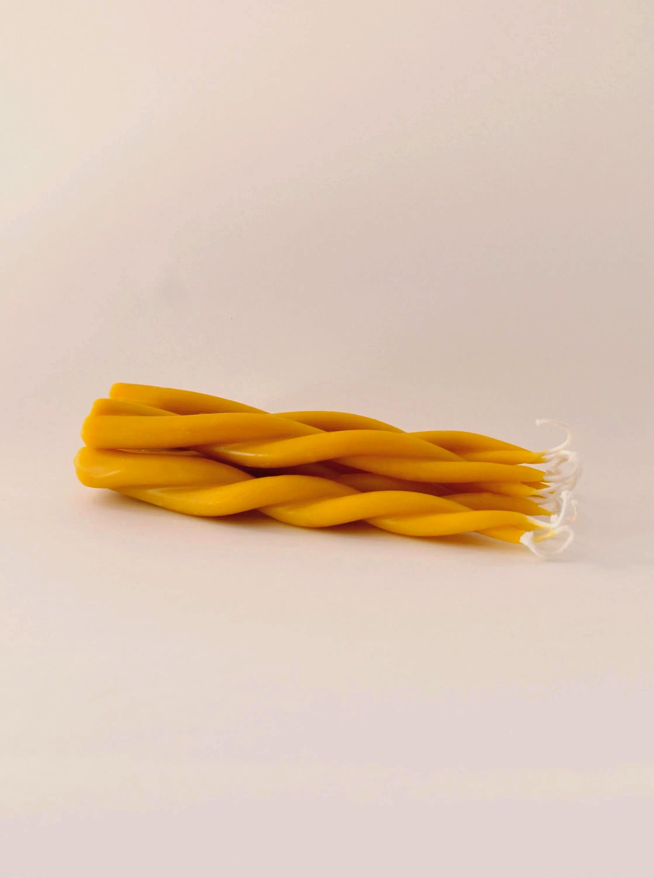 Beeswax twisted tapered candlesticks for clean burning unscented natural candlelight.