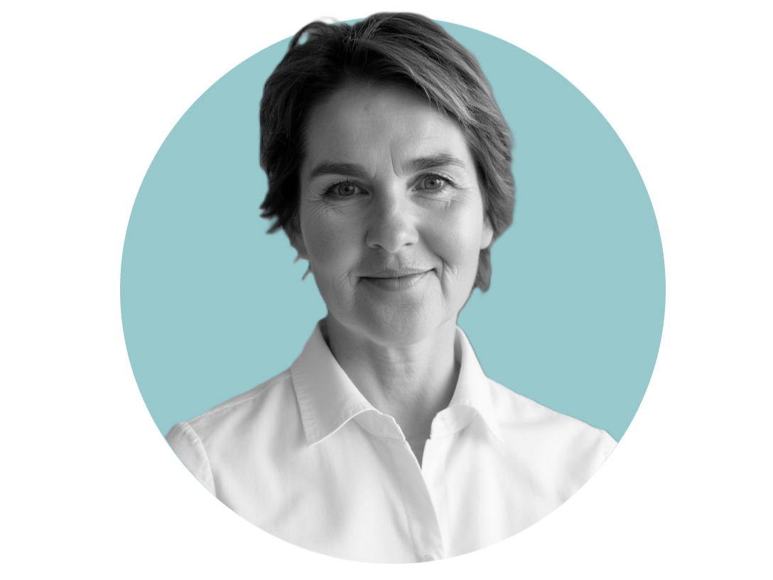 Black and white portrait of a woman with long hair against a teal background.