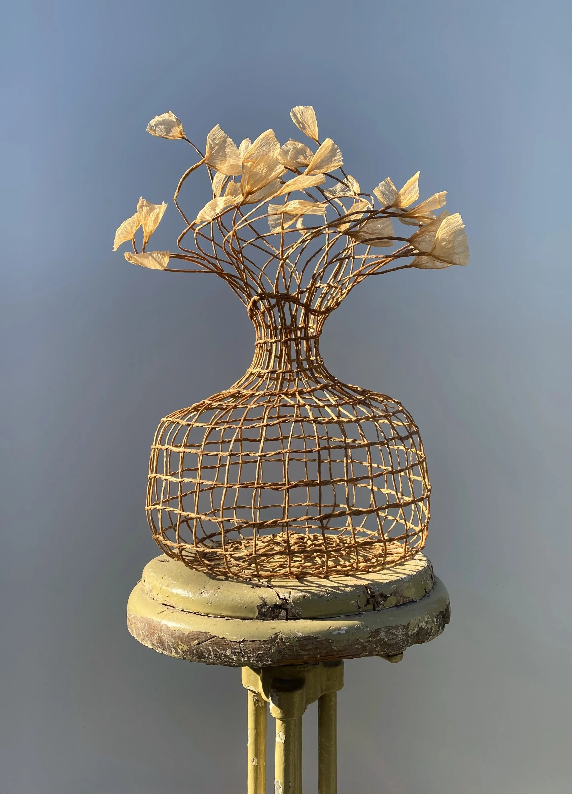 Woven vase in natural brown