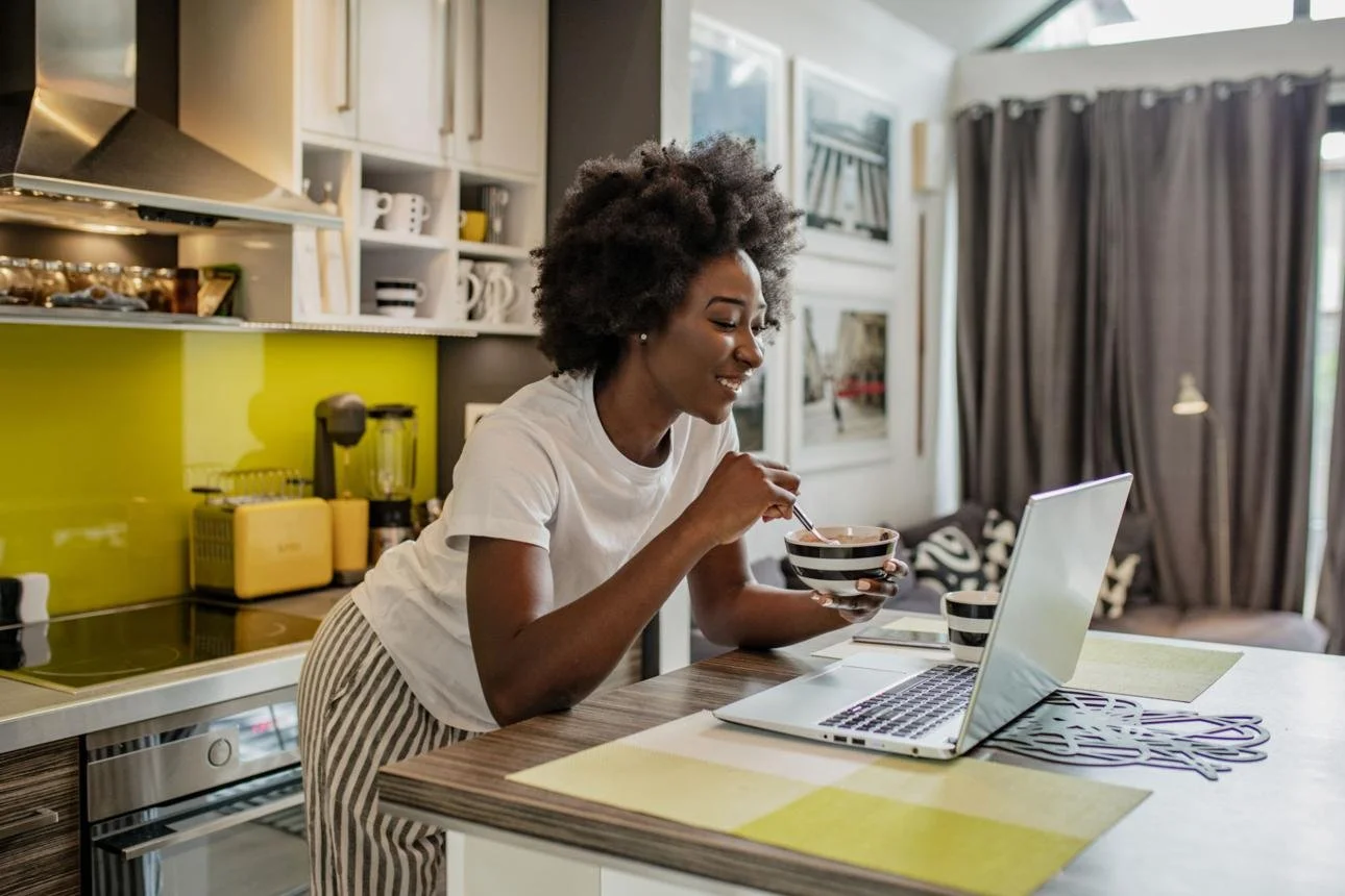 Busy mom enjoying a quick healthy breakfast and coffee in the morning