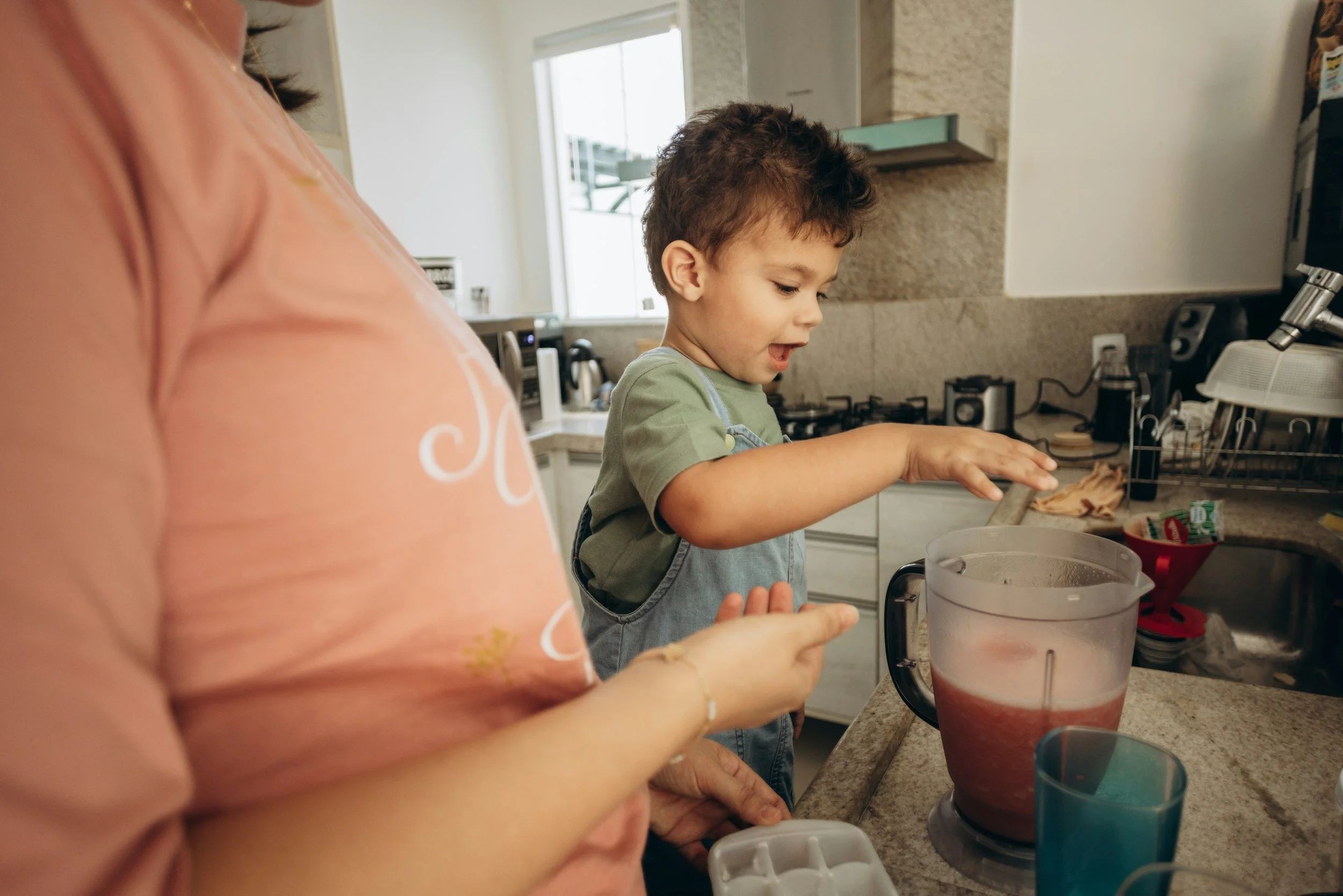 Mom helping her son blend a smoothie for a kid-friendly back to school breakfast