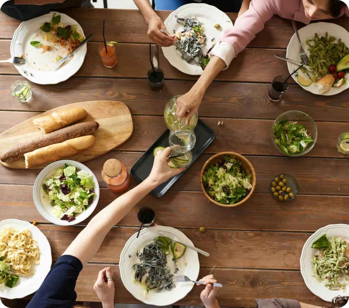 Moms sharing a meal together in an 8-week weight loss group coaching program