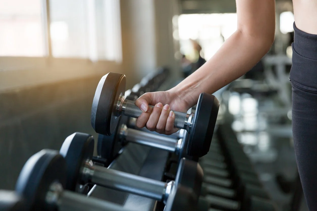 Woman doing a short strength-based movement routine in the morning.