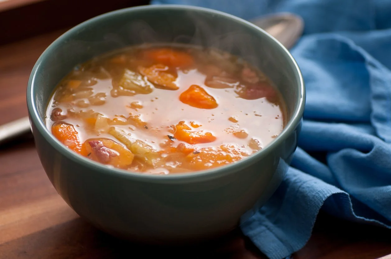 Bowl of hearty winter soup made with vegetables and protein, ideal for easy weeknight meals for busy moms.
