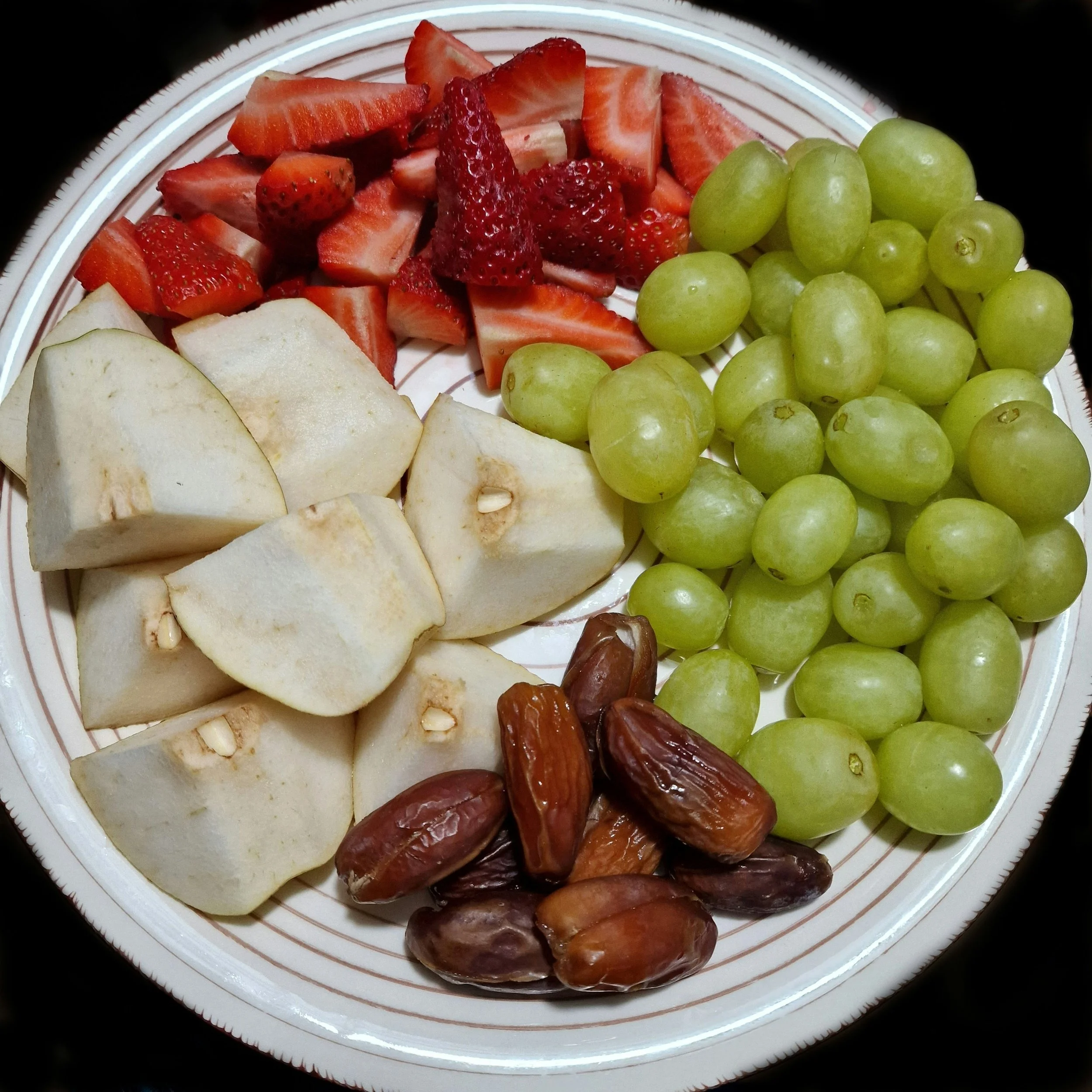 Kid-friendly after school snack ideas including strawberries, grapes, apples, and dates