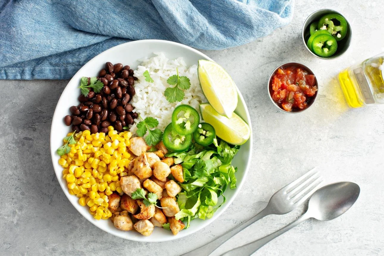 Chipotle bowl for weight loss with chicken, beans, and vegetables for protein and fiber