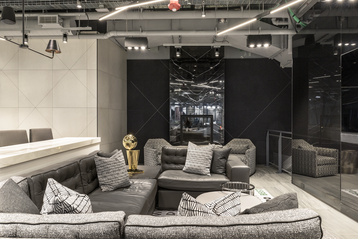 Commercial office interior design in Houston with contemporary lounge seating, monochrome finishes and a polished client-facing atmosphere