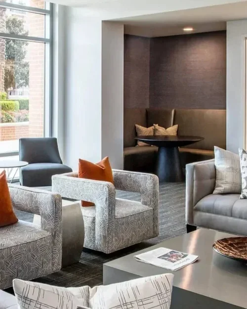 Commercial interior design project at Highland Tower, with a multifamily amenity lounge, patterned seating and dining nook.