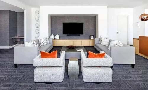Commercial interior design project at Highland Tower, featuring a contemporary lounge with symmetrical seating.