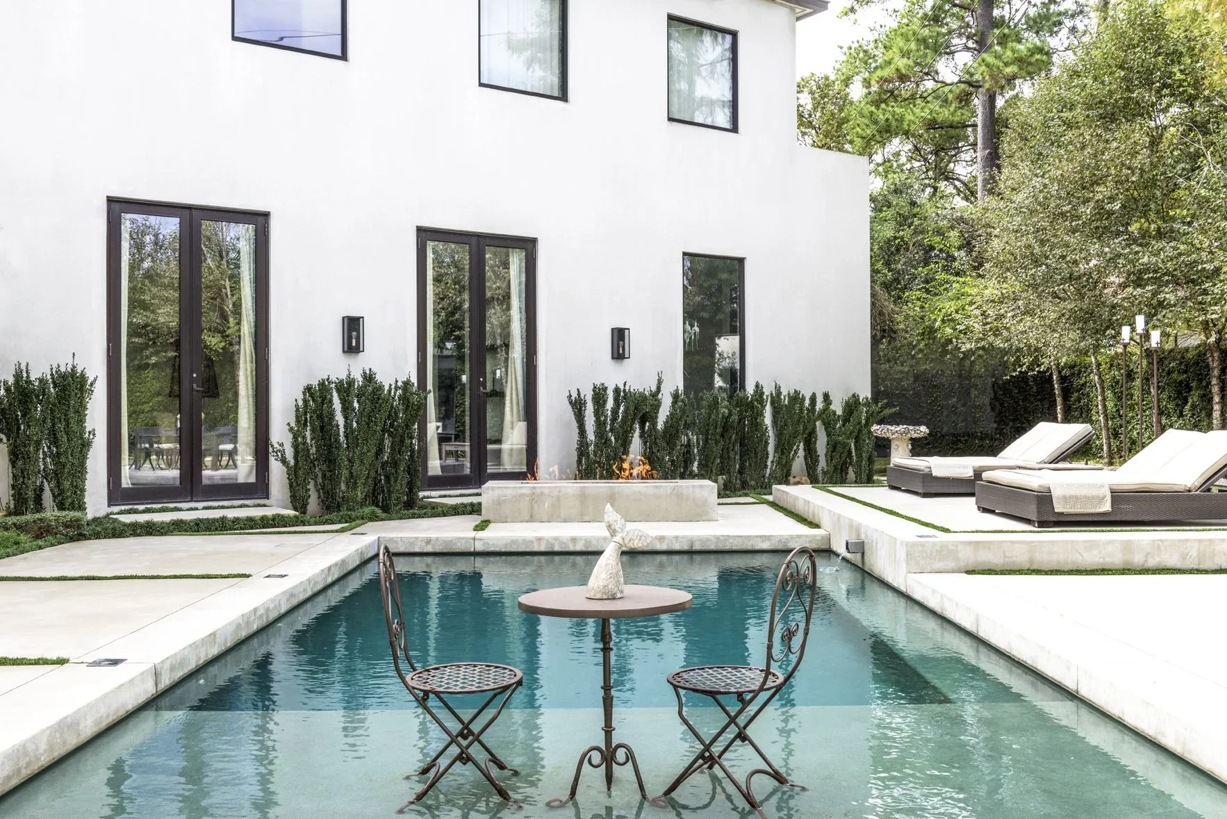 Luxury home design Houston featuring private courtyard pool and modern architectural landscaping