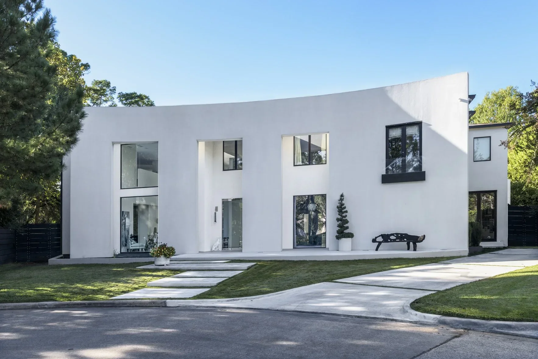 Modern Memorial Area residence designed by a Houston interior designer, featuring clean architectural lines, curated landscaping, and a refined contemporary aesthetic.
