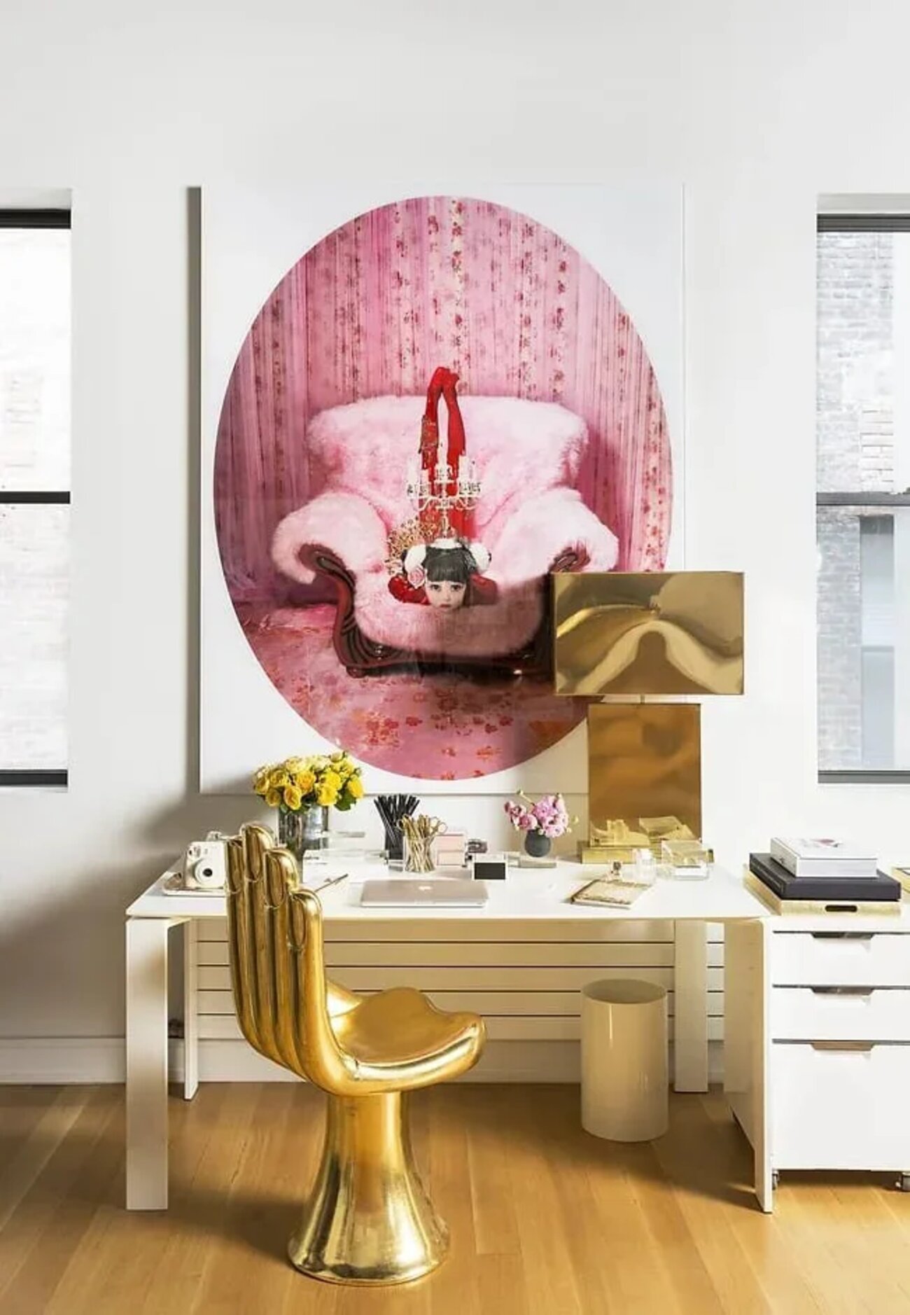 Clapton Chapel apartment home office with a gold sculptural chair, white desk and large pink artwork.