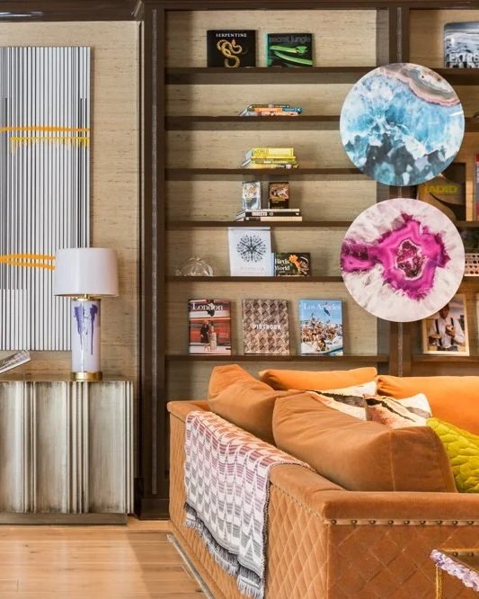 Luxury living room interior design in Houston with sculptural lighting, geometric rug, and tailored furnishings at Timberwilde.