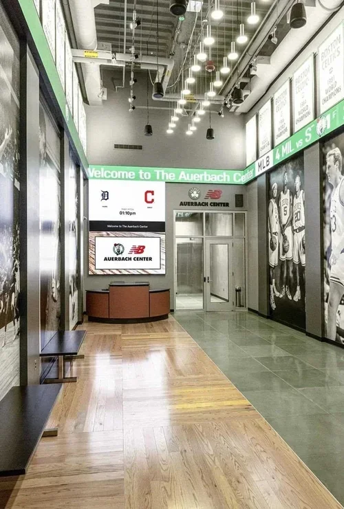 Commercial interior design project at the Boston Celtics Auerbach Center, with basketball-inspired flooring and reception.