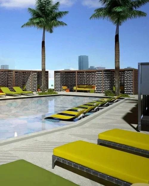 Commercial interior design project at Thompson Hotel Houston, with a rooftop pool, lime green loungers and skyline views.