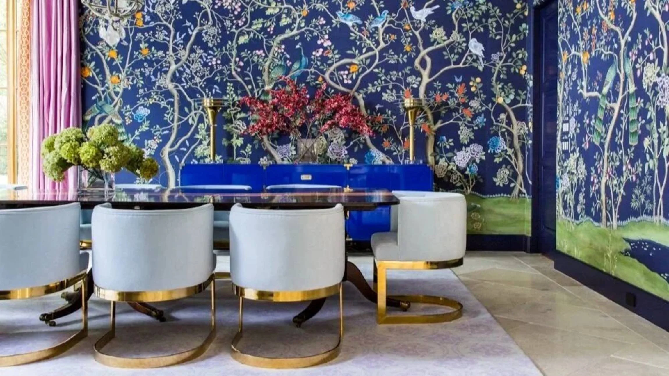 Timberwilde residence sitting area with an orange leather sofa, built-in shelving and colourful circular artwork.