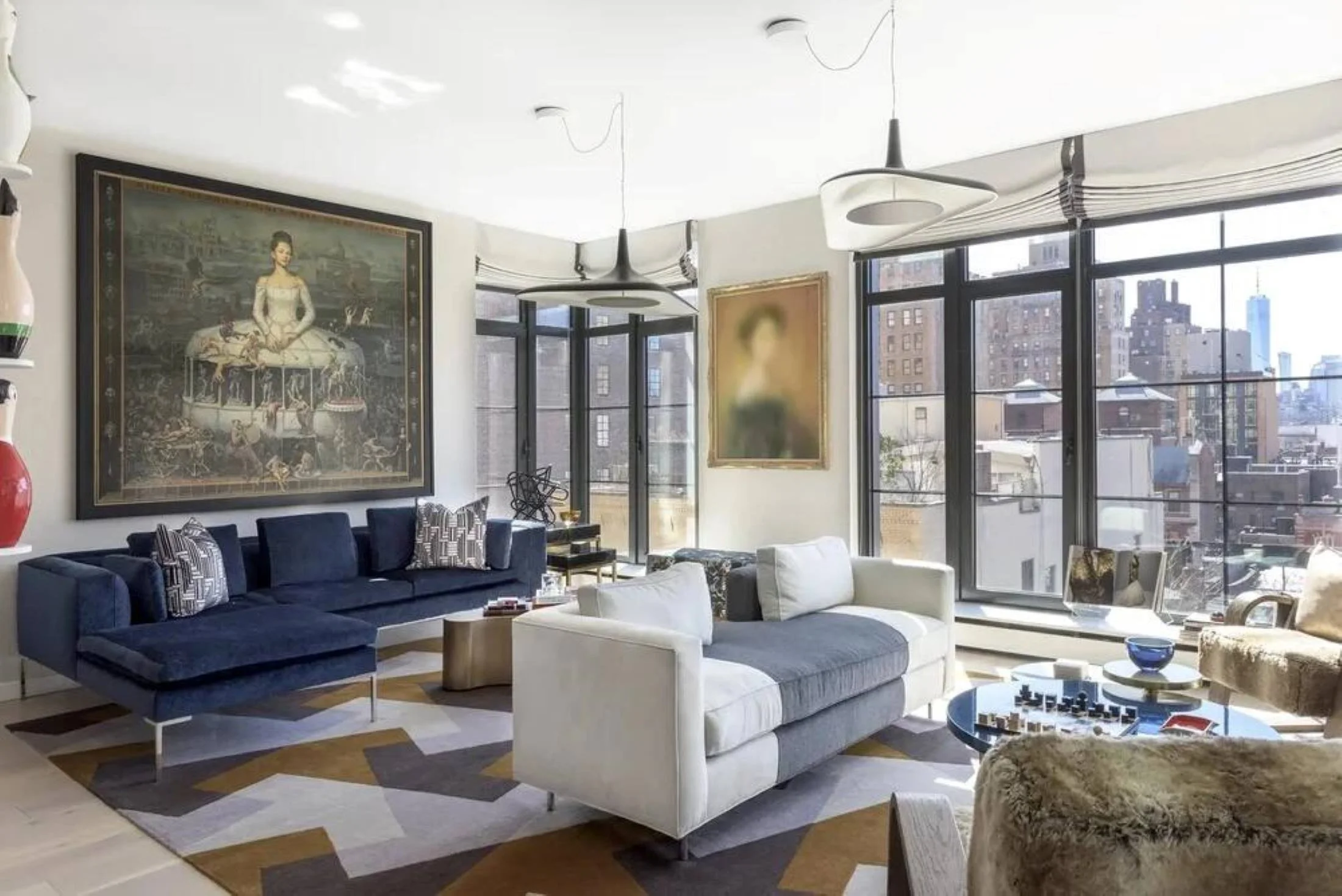 New York Chelsea apartment by Lucinda Loya Interiors with contemporary furnishings, art and skyline views.