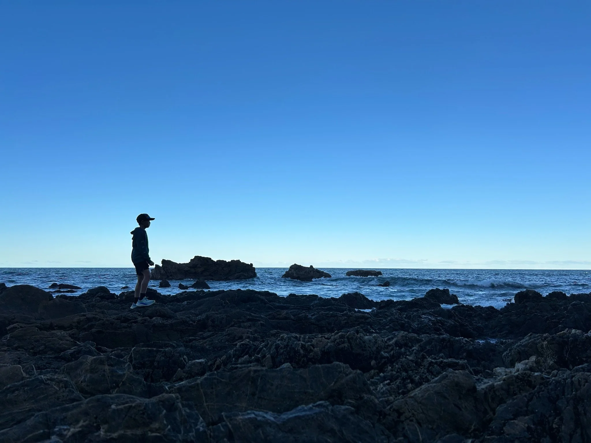 Exposed rocks along the shore after recent storms.