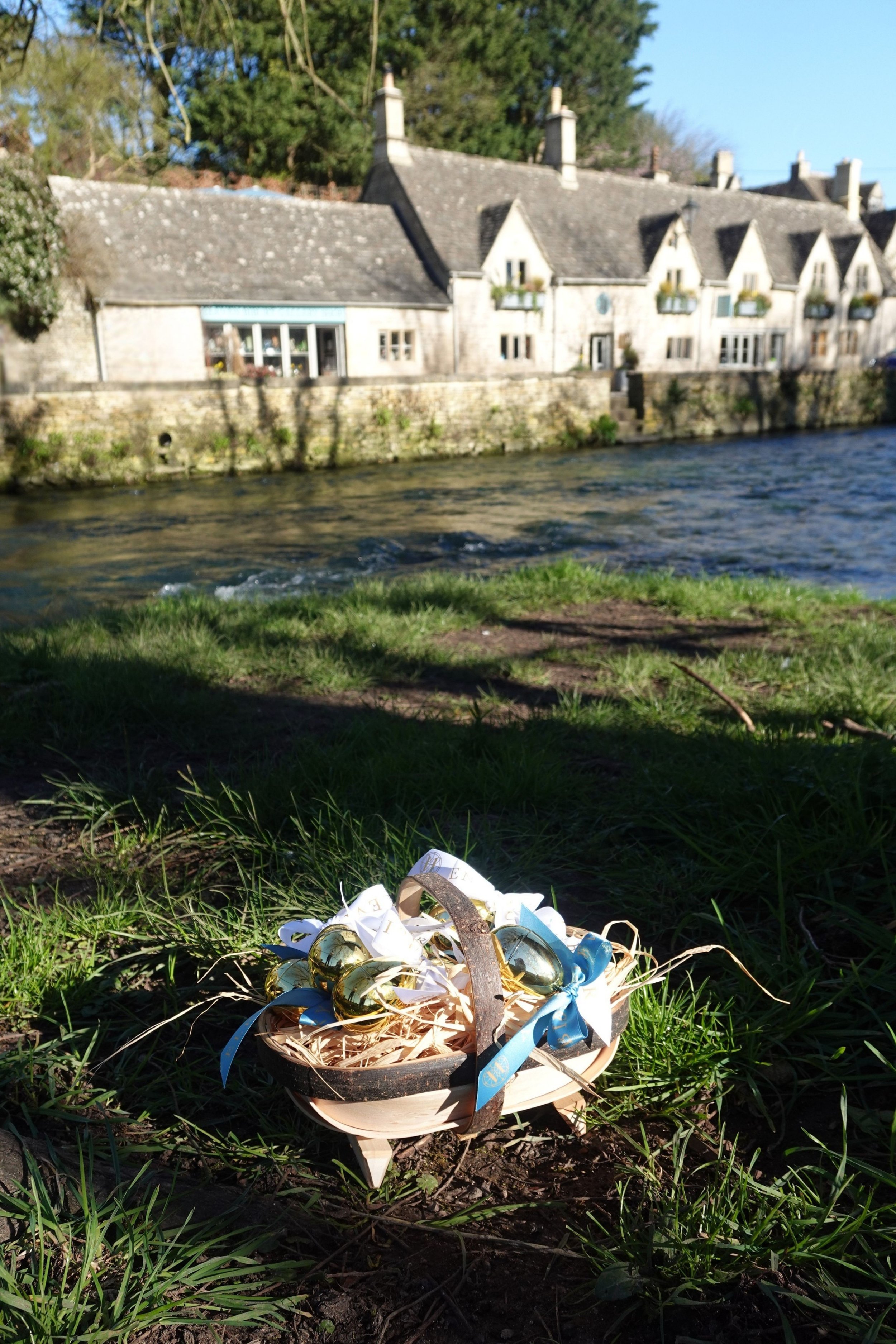 a basket of golden eggs in front of eleven bibury