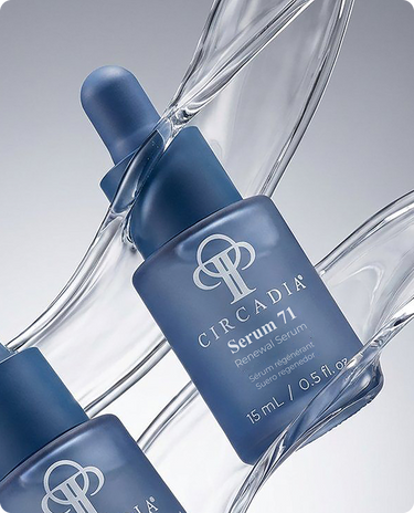 A blue bottle of Circadia Serum 71 Renewal Serum with a dropper, placed on a clear glass surface.