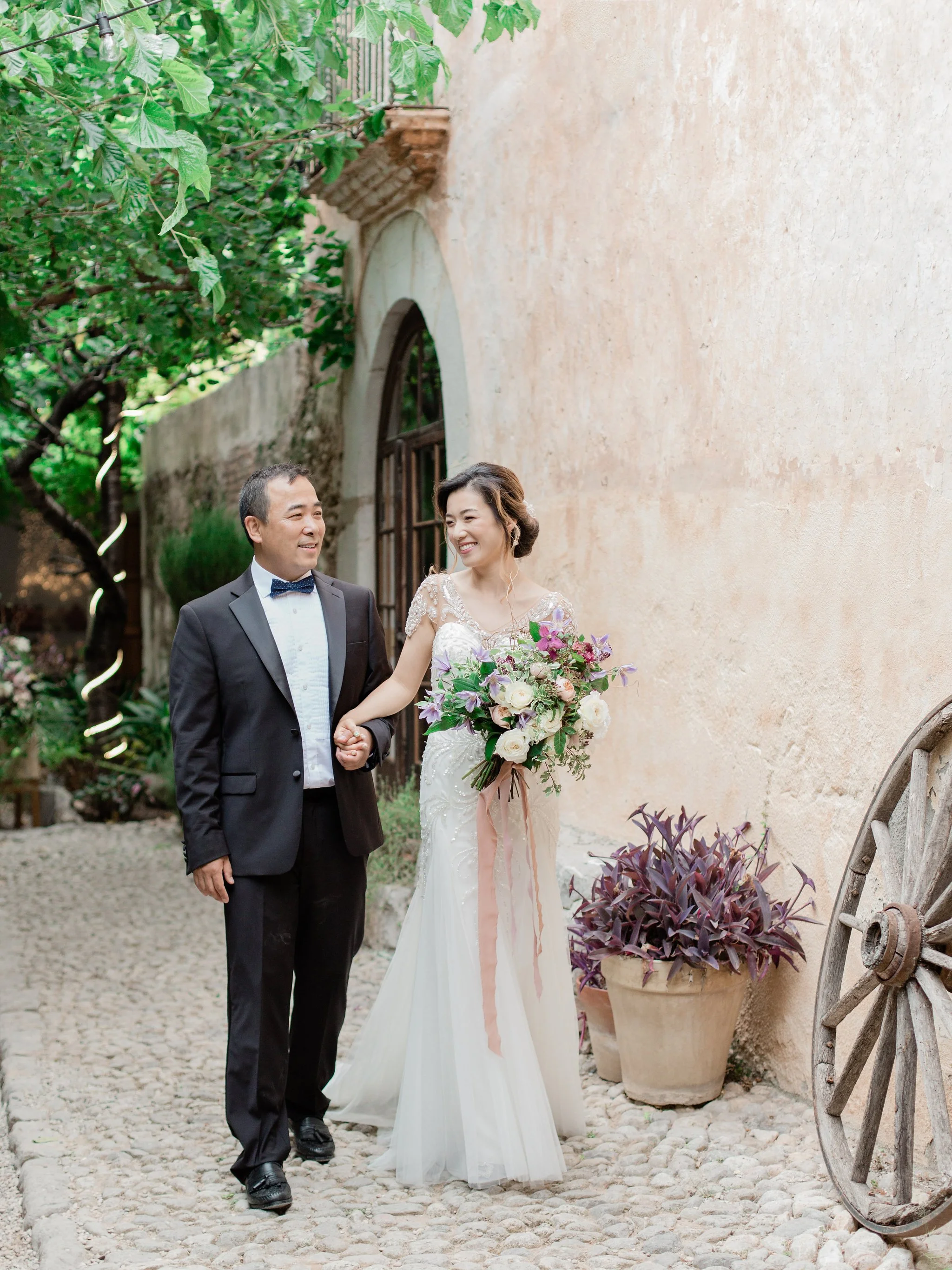 Bride and groom wedding cake cutting ceremony