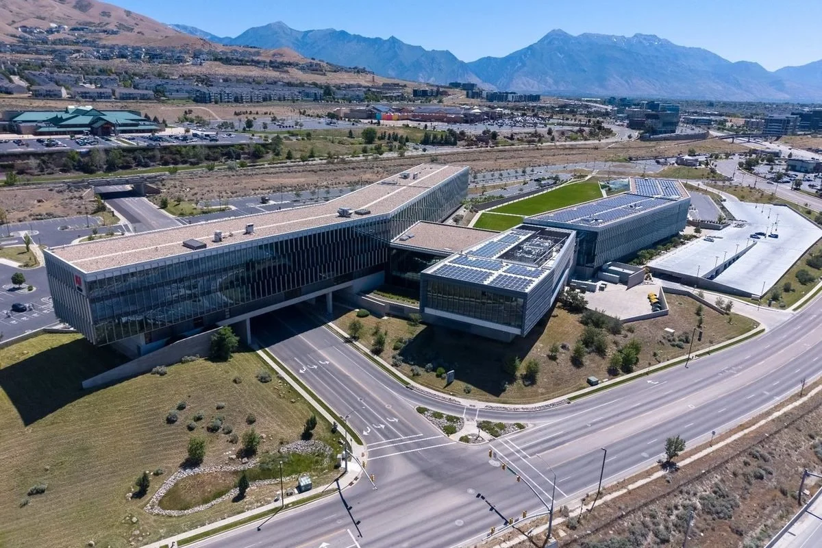 Modern office buildings in Lehi, Utah, surrounded by mountains in the Silicon Slopes technology corridor.