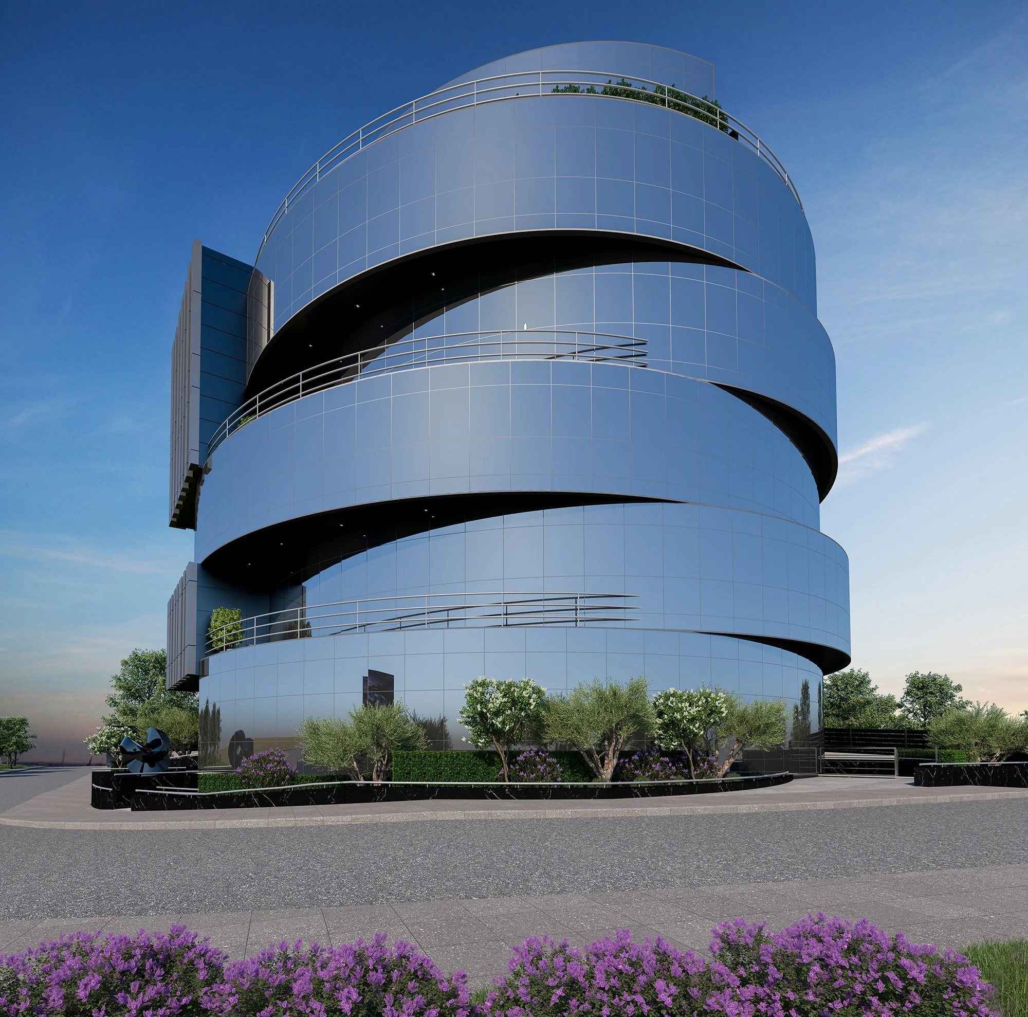 Modern cylindrical glass building with spiral design, surrounded by landscaped greenery and purple flowers, set against a clear blue sky.