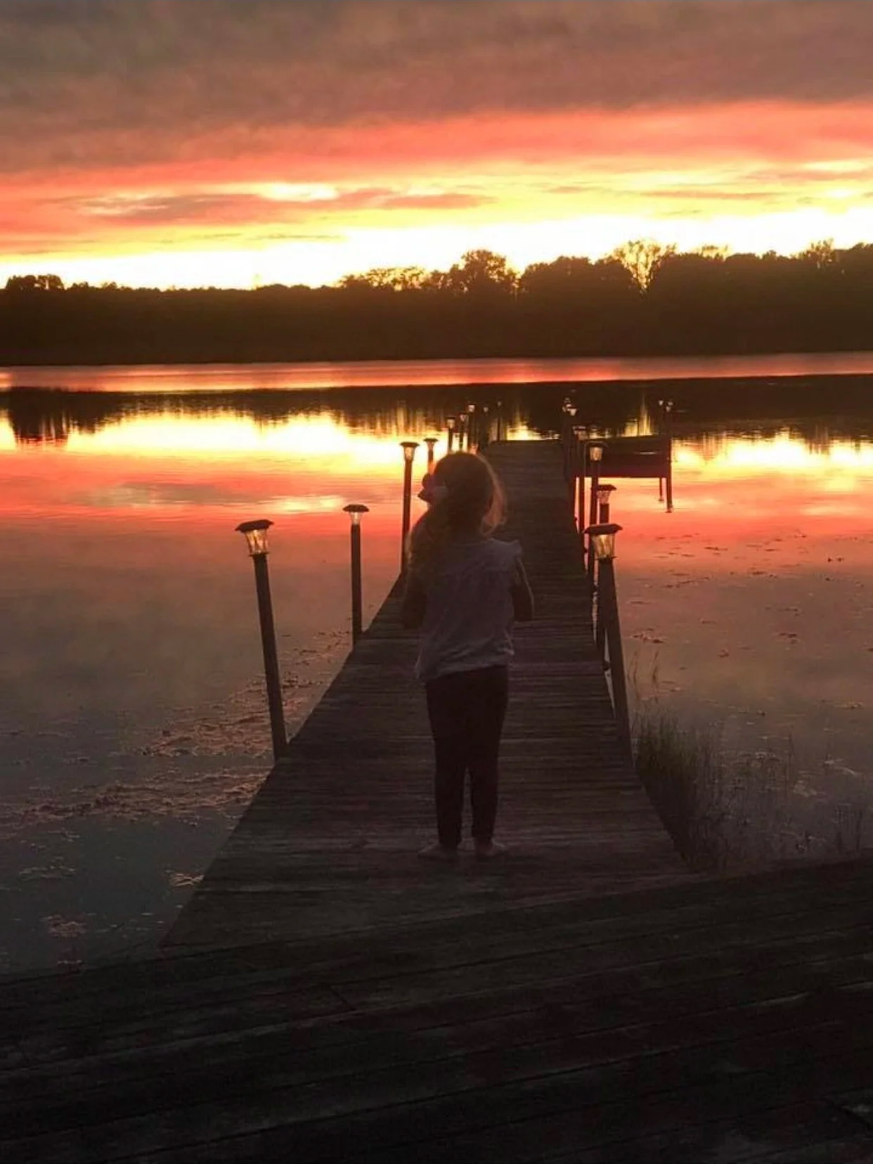 Sunset over Walled Lake Novi Michigan waterfront homes.png