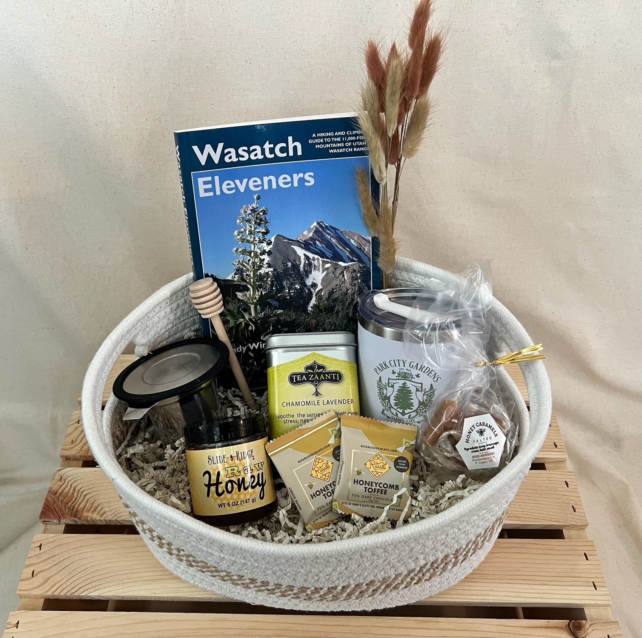 Utah Wasatch gift basket with honey, chocolate, tea, travel mug, and hiking guide in rope basket