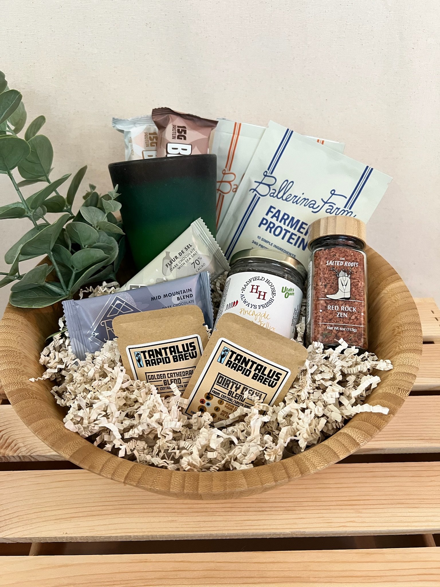 Utah morning gift basket with freeze dried coffee, Ritual Chocolate, protein bars, and spice blend in a bamboo bowl