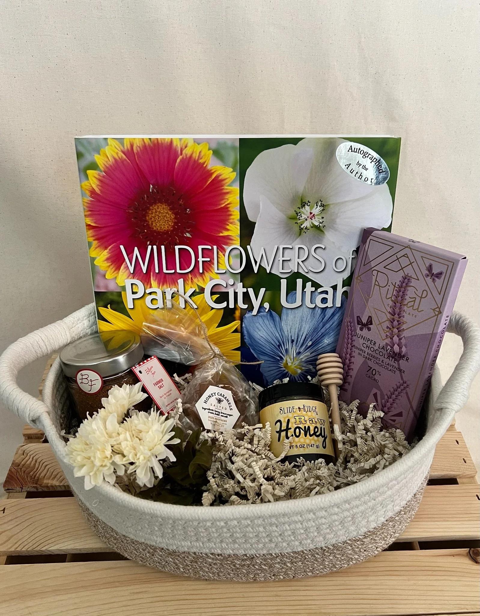 Utah wildflower gift basket with autographed book, honey, Ritual Chocolate, and salted caramels in rope basket
