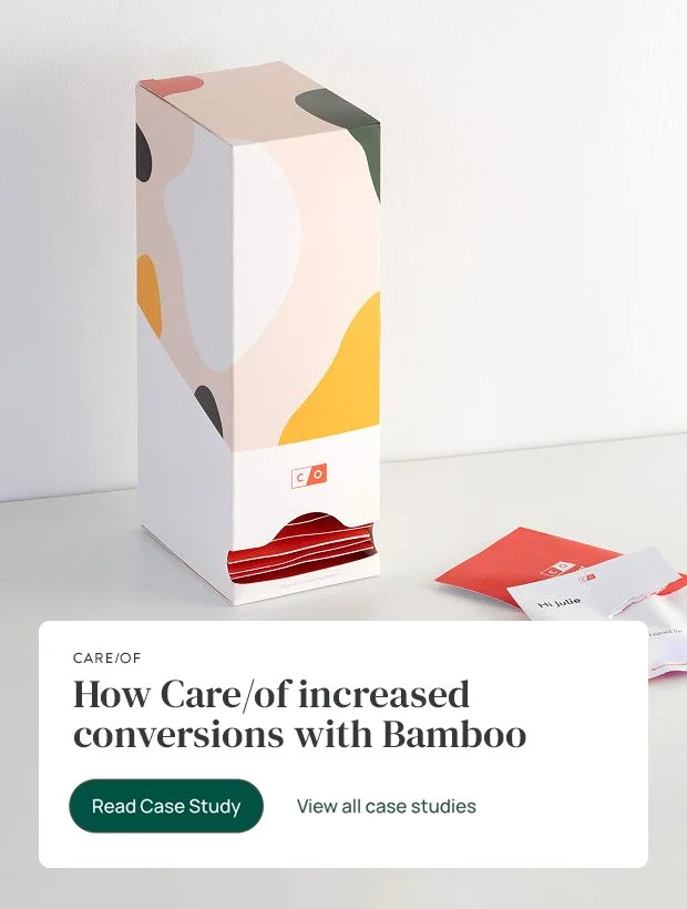 A cardboard box with colorful abstract patterns on a white surface, with a small paper or envelope beside it and a pause button graphic with text about increasing conversions using Bamboo.
