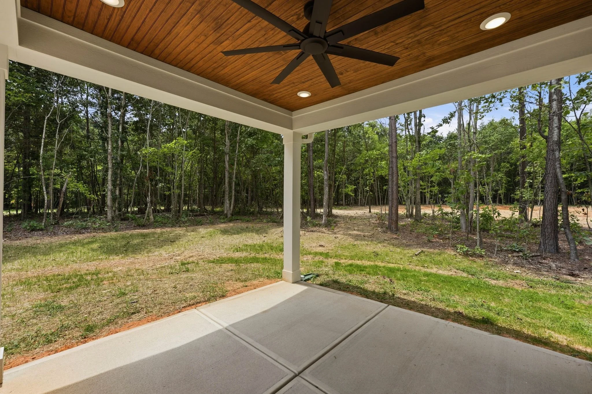 Back patio view of backyard of new home in Baylor Grove neighborhood