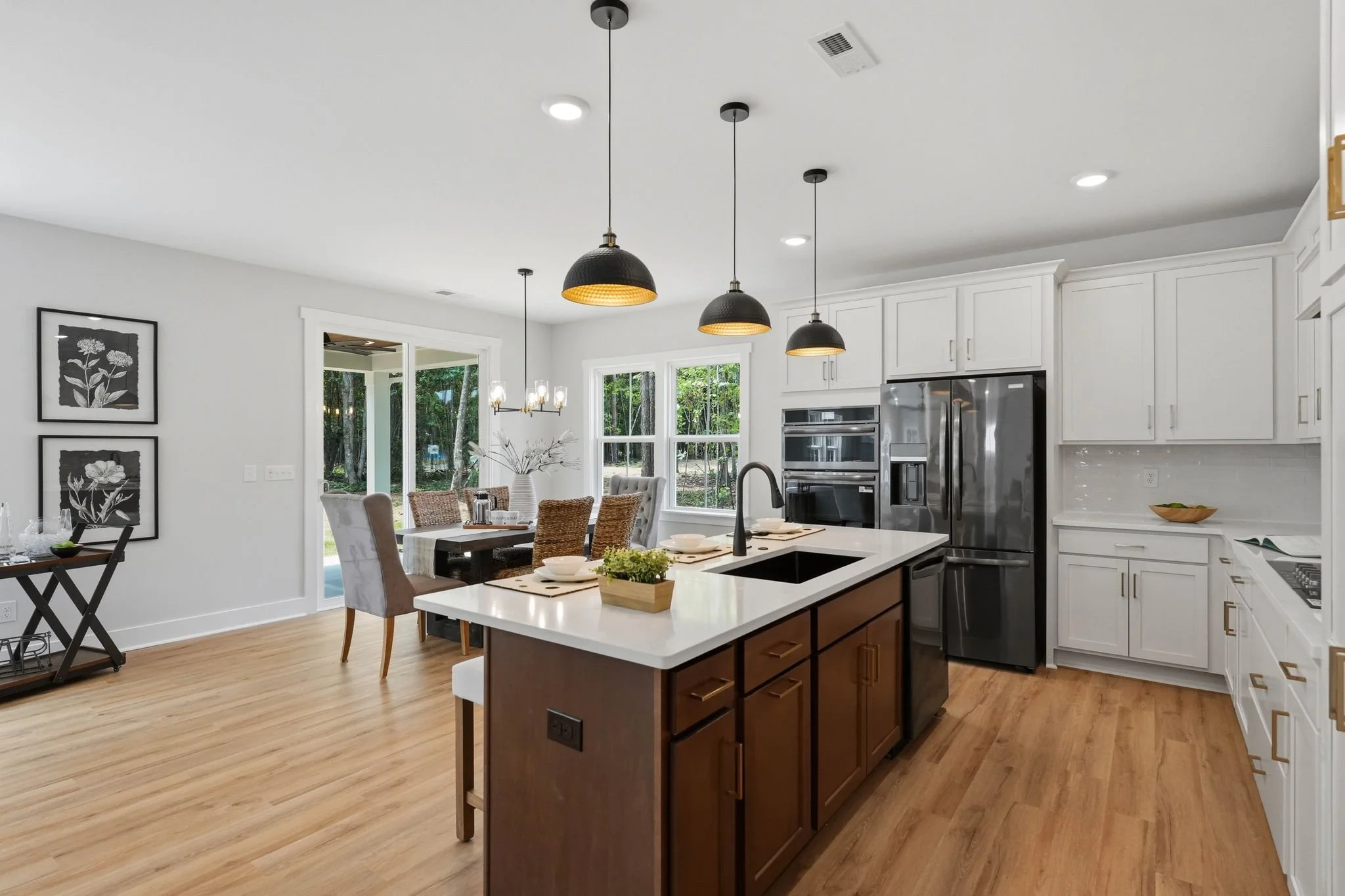 Designer kitchen with white cabinetry and large island