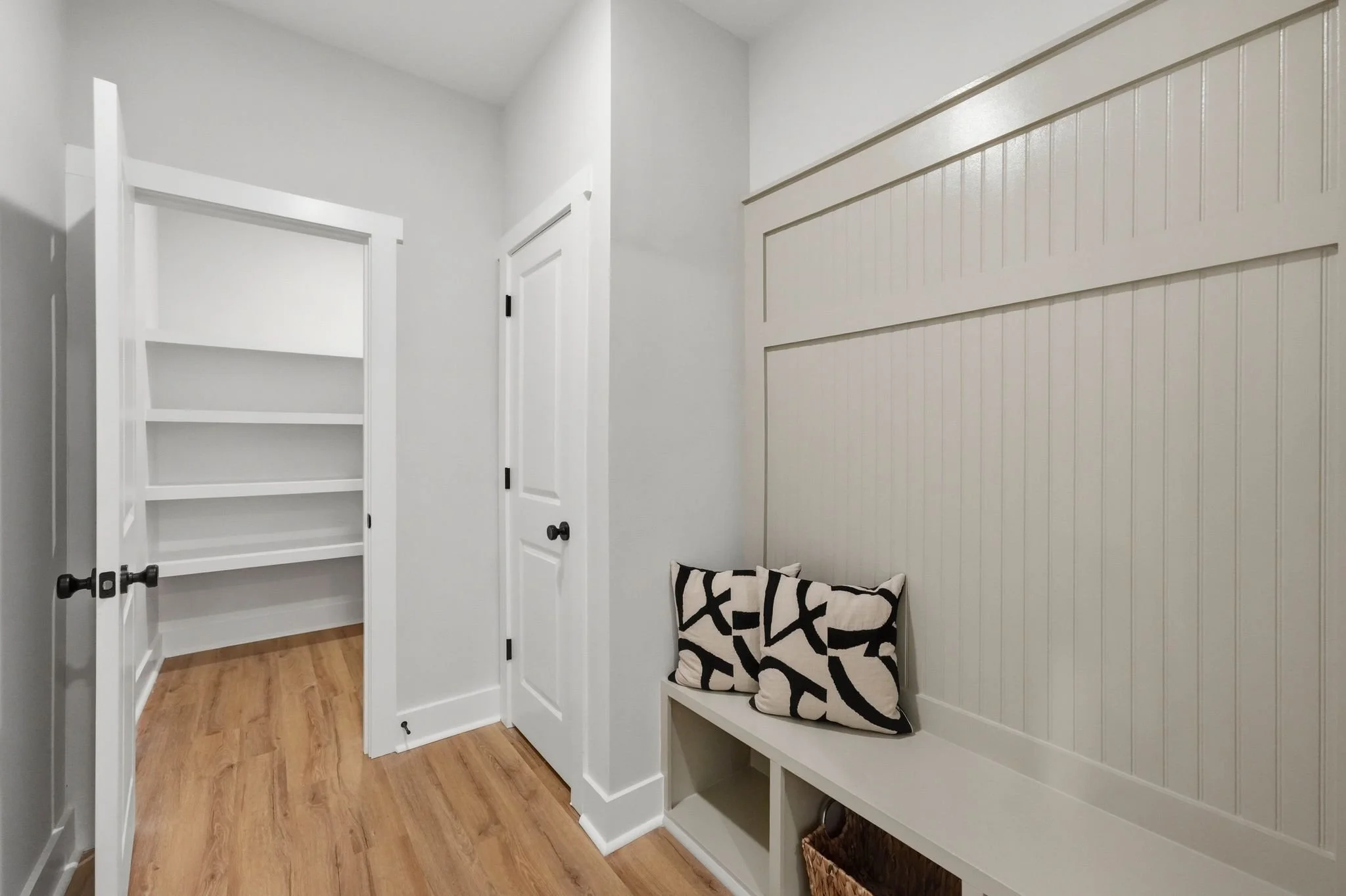 Spacious walk-in closet with custom shelving in a new construction home