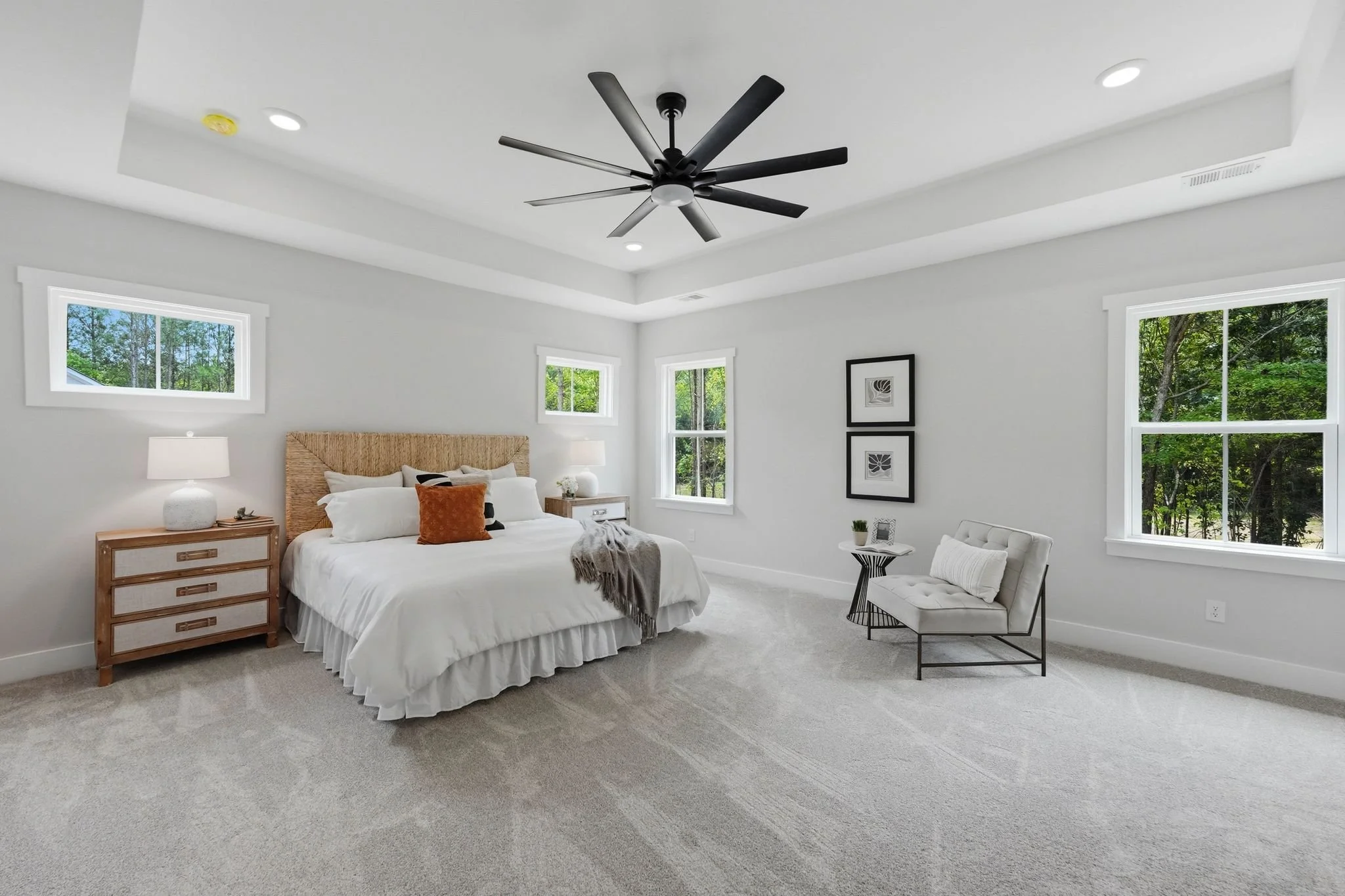 Spacious primary bedroom with in a semi-custom home