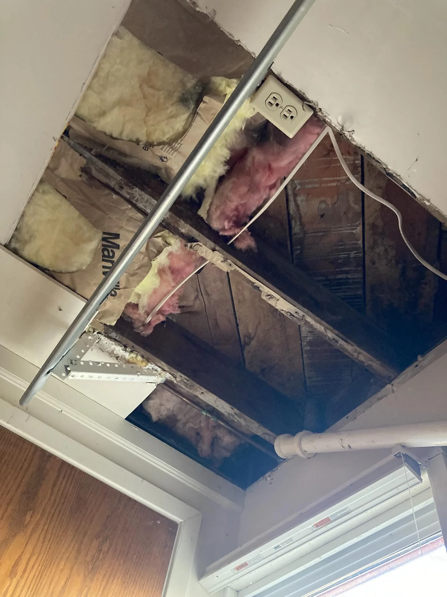 Drywall patch in a garage ceiling. Not taped for now.