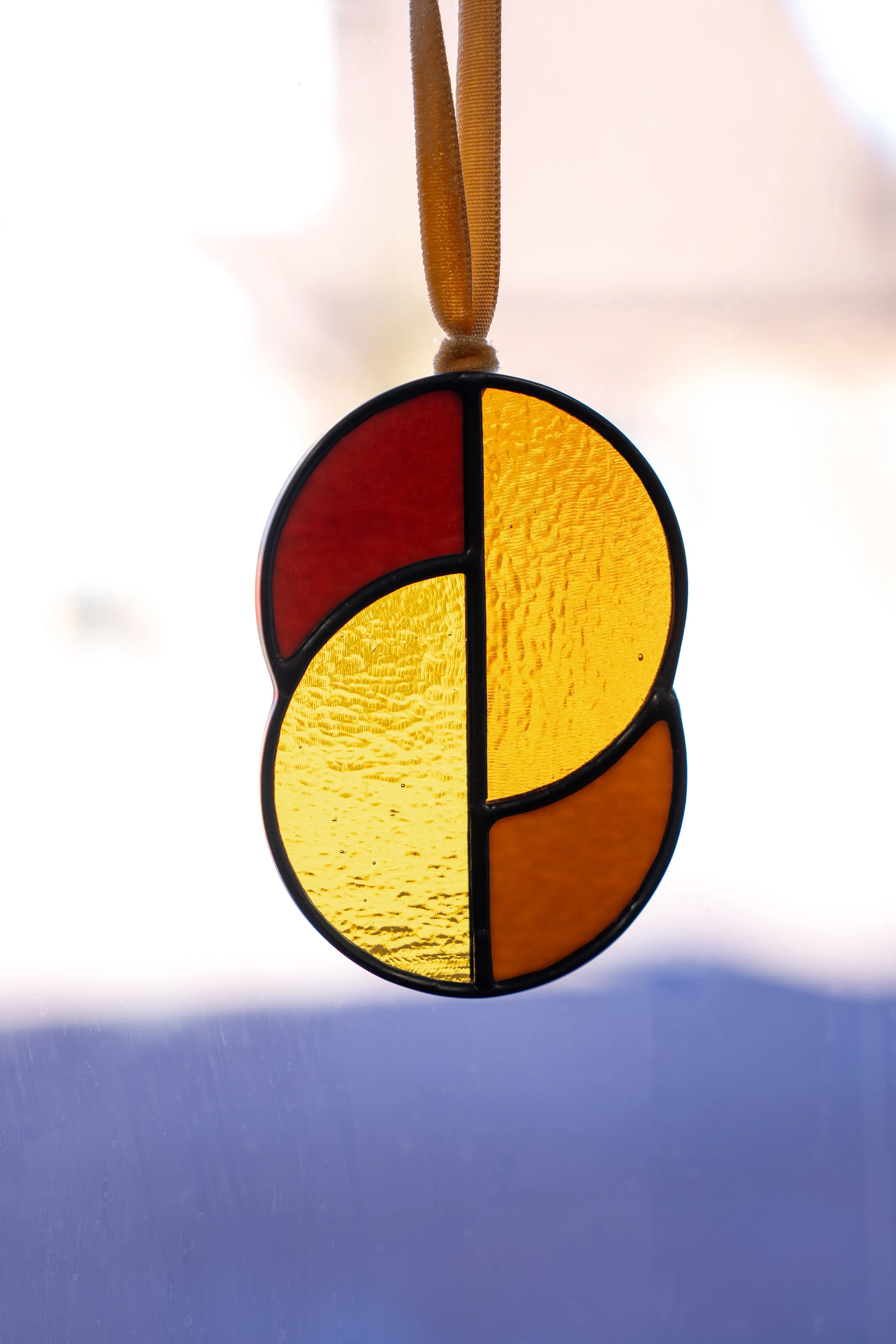 stained glass in window by artist Kate Hay