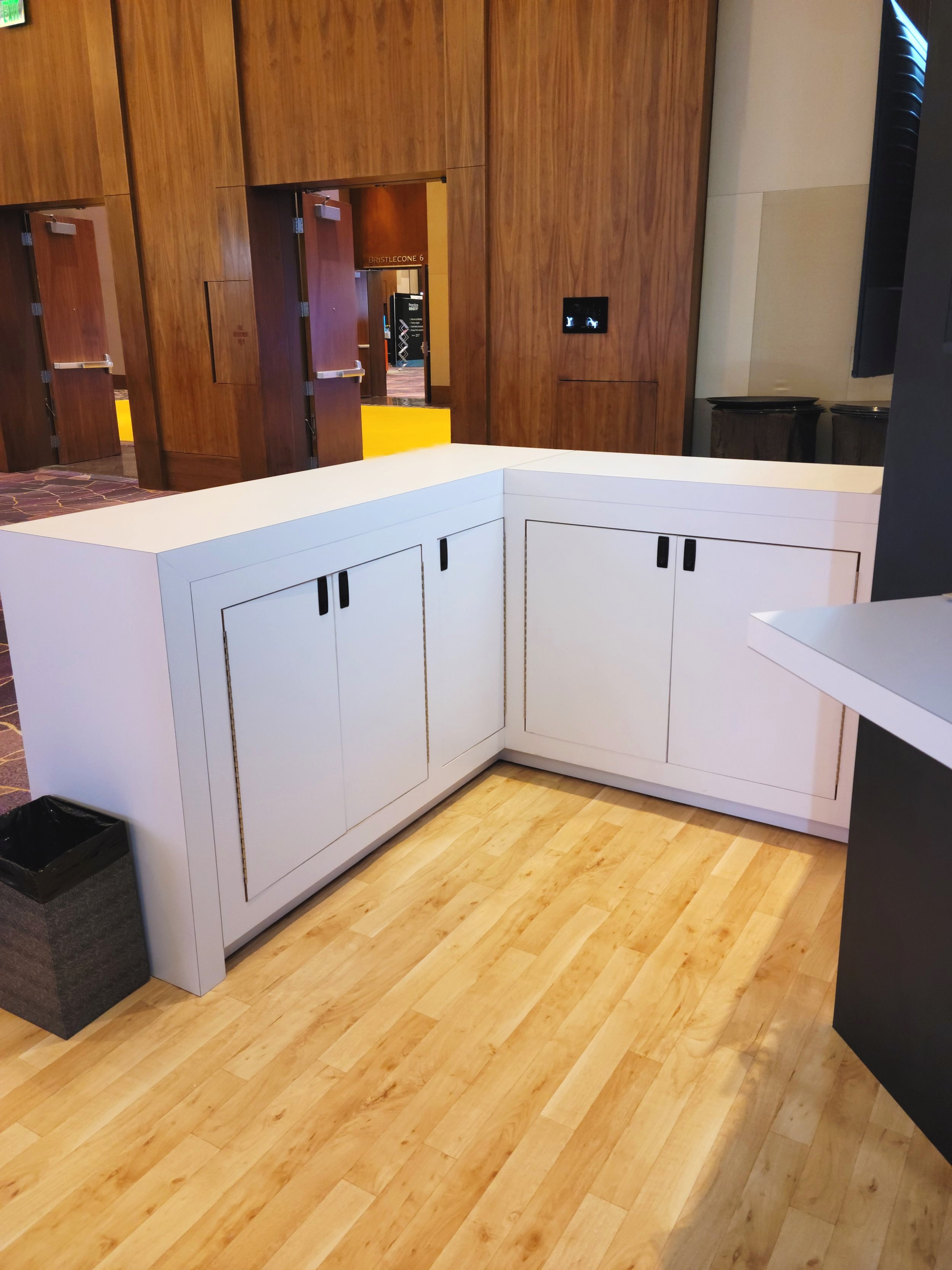 Backside of cabinets and warm laminate flooring with pad