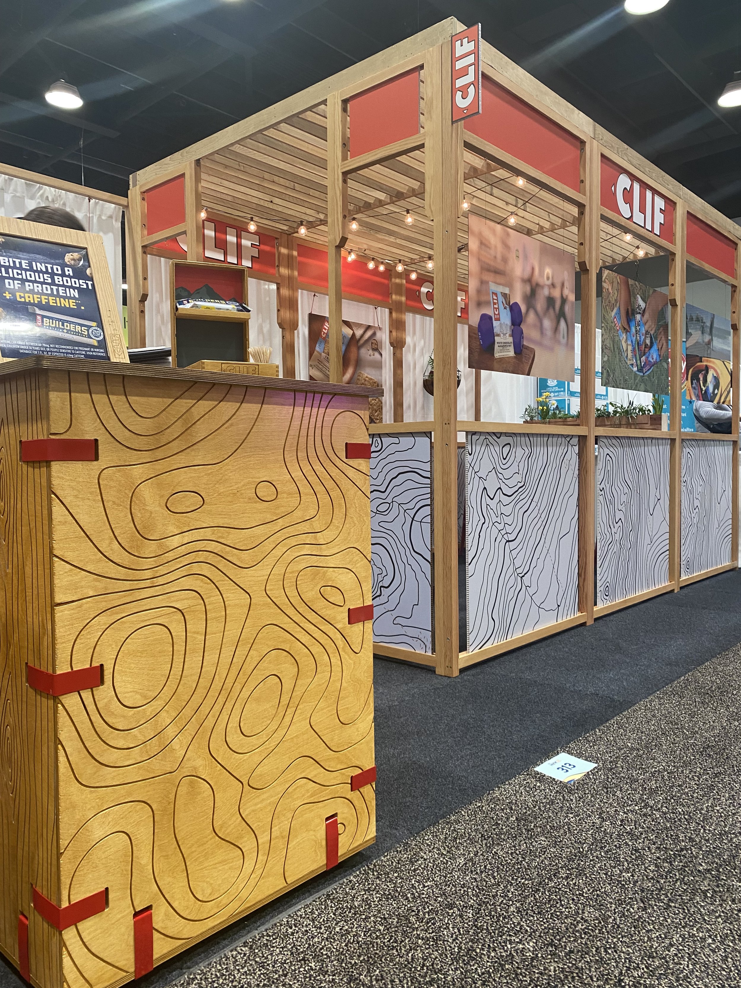 Perspective view showing topography theme featured in different parts of the booth